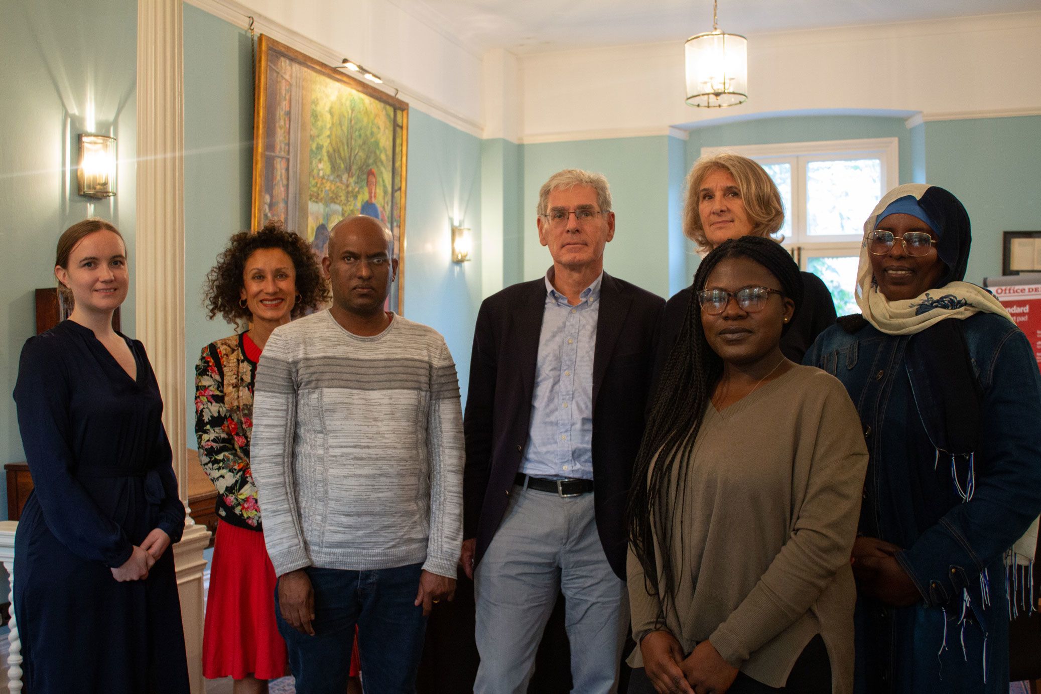 Muriel and Marcel Jongen with scholarship students from Birkbeck, in a group photo in the Keynes Library